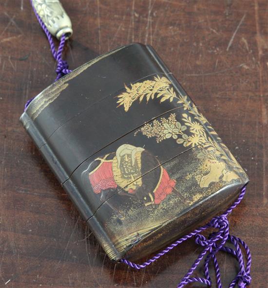 A Japanese lacquer three case inro, 19th century, 7cm, with a brass ojime